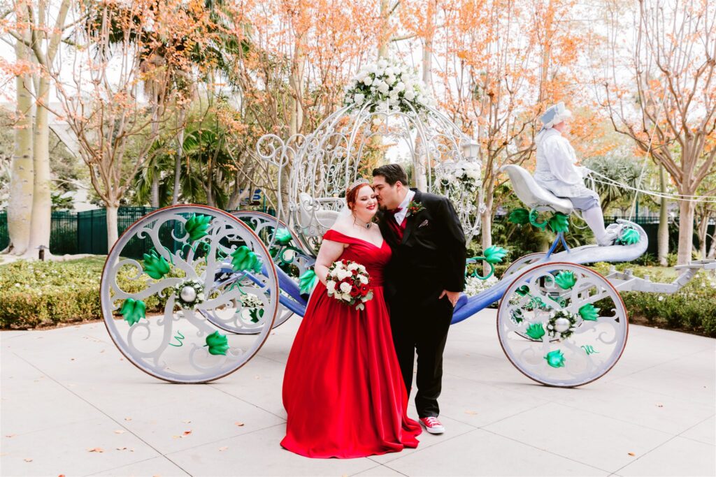bride and groom with cinderella's carriage