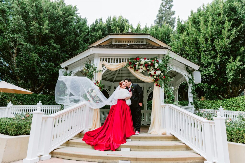 bride and groom at gazebo in disneyland