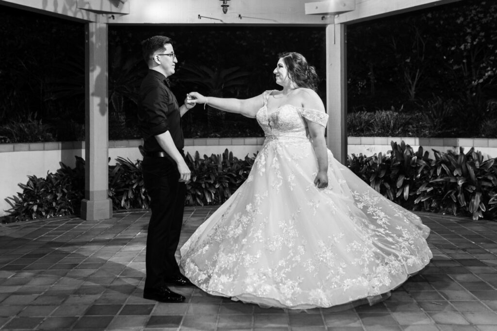 bride twiling with groom