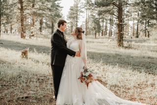 groom and bride wearing lace and tulle aline wedding dress in flagstaff, arizona woods