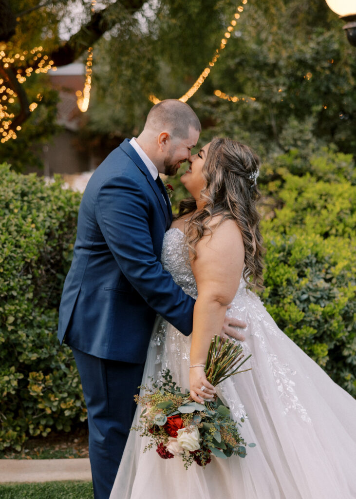 groom in blue suit with plus size bride in glam ballgown wedding dress mesa arizona