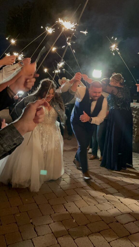 groom in blue suit with plus size bride in glam ballgown wedding dress mesa arizona sparkler exit