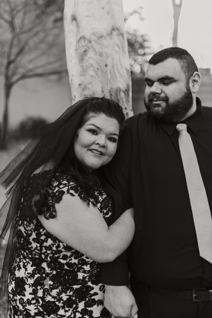 bride wearing plus size lace wedding dress groom in black shirt chandler arizona