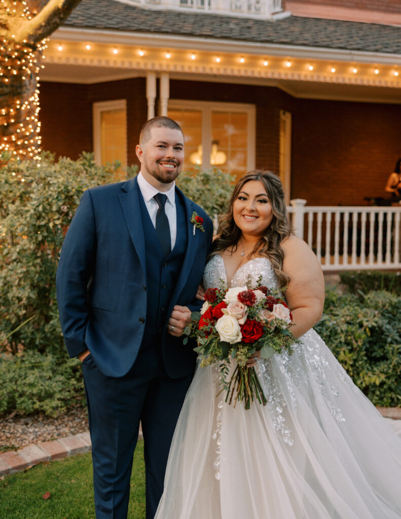 groom in blue suit with plus size bride in glam ballgown wedding dress mesa arizona