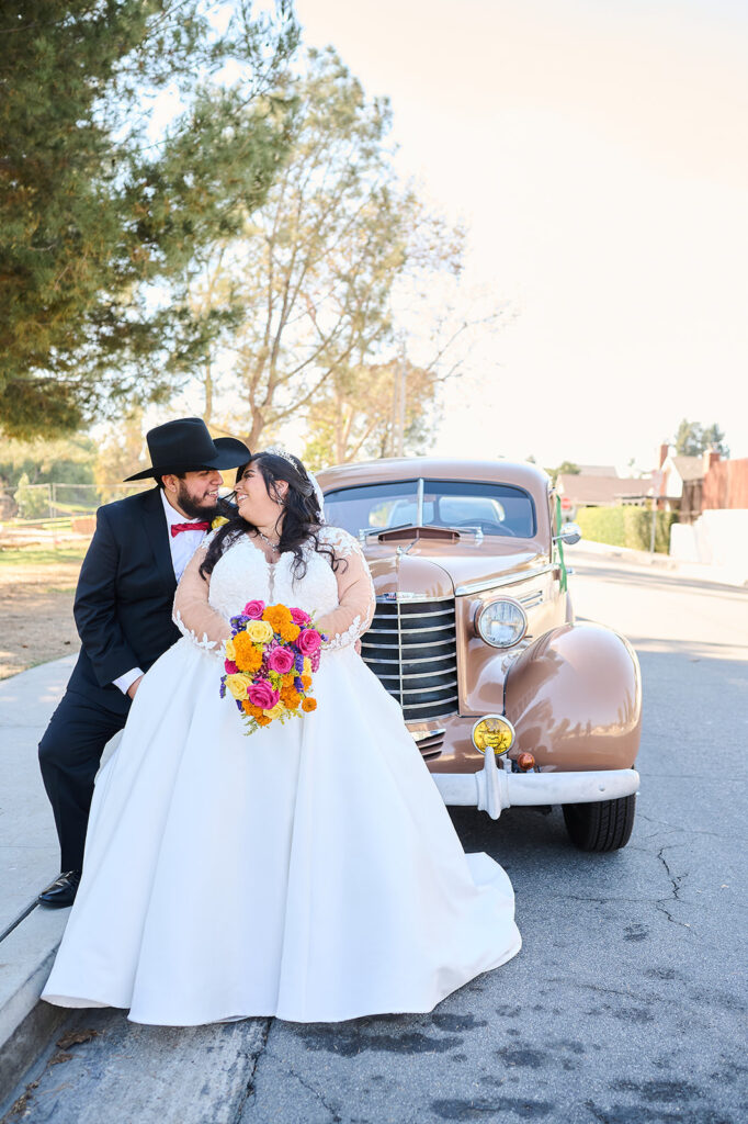 plus size bride in long sleeve plus size wedding dress whittier california with old car