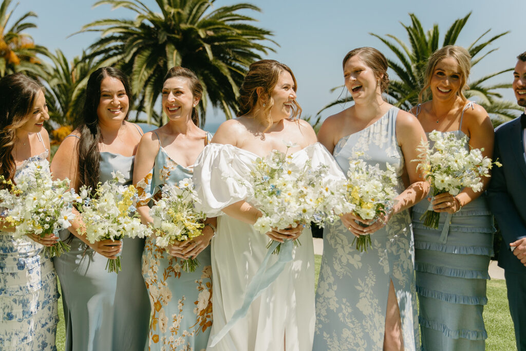 mid size bride wearing classic satin aline wedding dress with puff sleeves