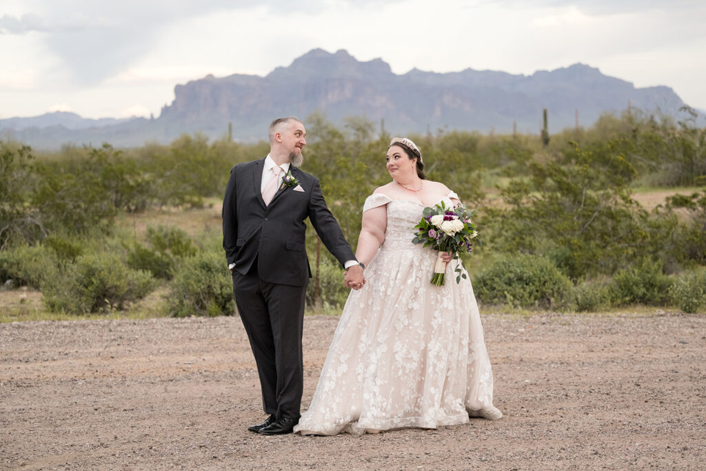 plus size bride wearing champagne and lace wedding dress groom in suit superstition mountains arizona outdoor wedding