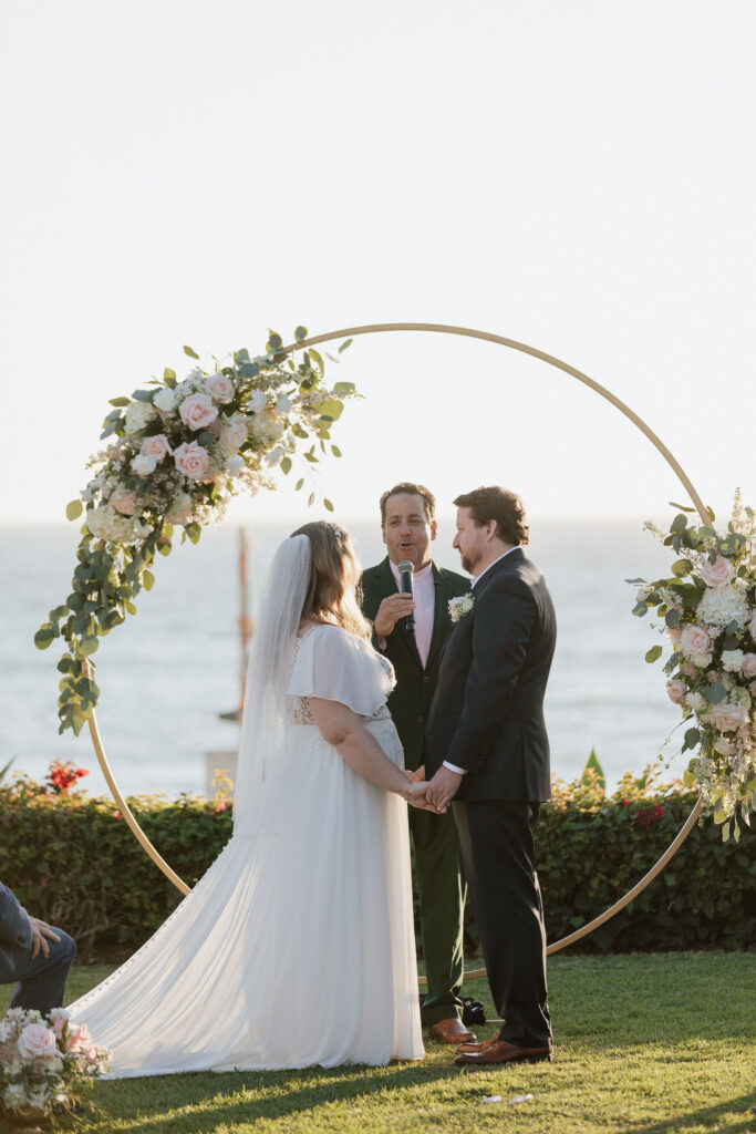 mid size bride wearing chiffon aline wedding dress with custom sleeves