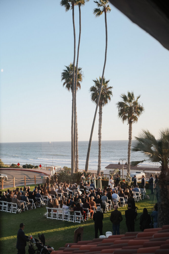 ocean side wedding ceremony with palm trees
