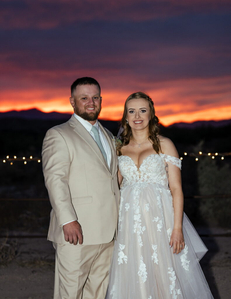 bride in aline wedding with lace tulle groom in tan suit