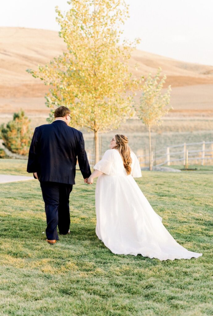 plus size organza ballgown wedding dress with sleeves chandler arizona bridal shop with plus size groom