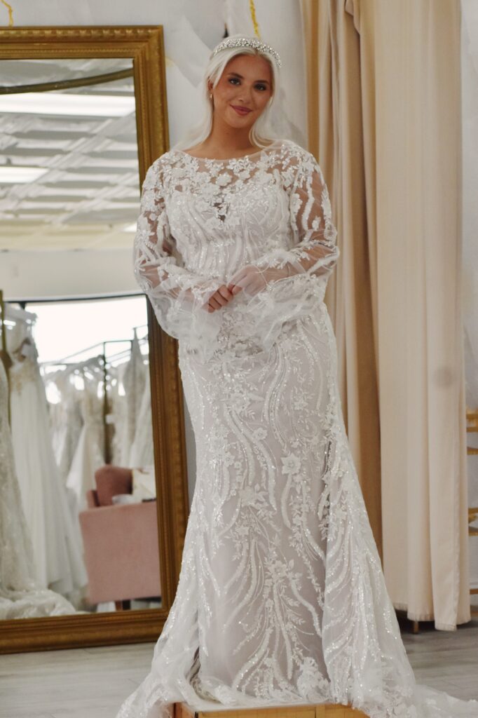 bride wearing long sleeve modest discount wedding dress in gilbert az bridal shop