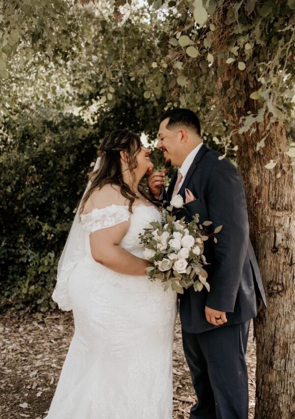 plus size bride and groom kissing
