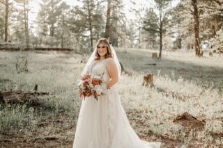 bride wearing lace and tulle aline wedding dress in flagstaff, arizona woods