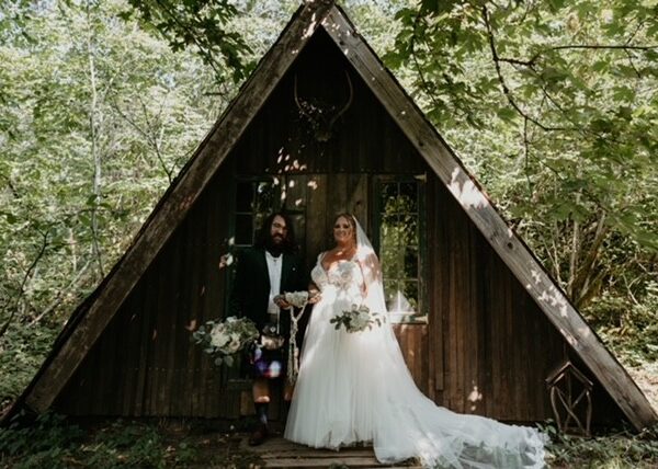 bride wearing plus size aline wedding dress in woodsy oregon wedding